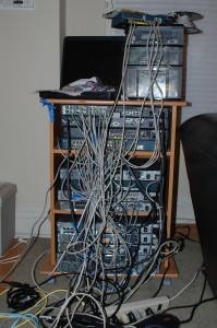 The author's 2008 CCIE security lab. The laptop ran Windows Server in a VM for ACS. An ASA 5505 is visible on top of the drawers.